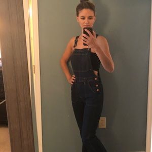 Flare leg denim overalls.